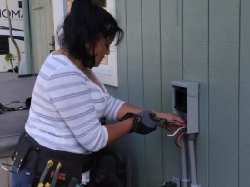 Licensed electrician wiring an exterior subpanel in Arcadia
