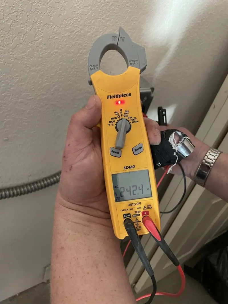Voltage testing with clamp meter during Outlet Installation in Arcadia